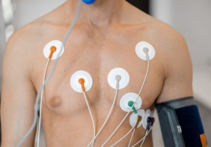 Torso of man athlete with electrodes